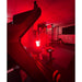 Person exercising in a gym with Fringe Red Light Panel