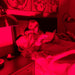 Person lying in bed under a Fringe Red Light Panel