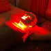 Woman wearing a Fringe Red Light Therapy Face Mask while lying down.