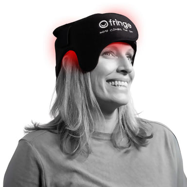 Person wearing a black Fringe Red Light Therapy Head Wrap.